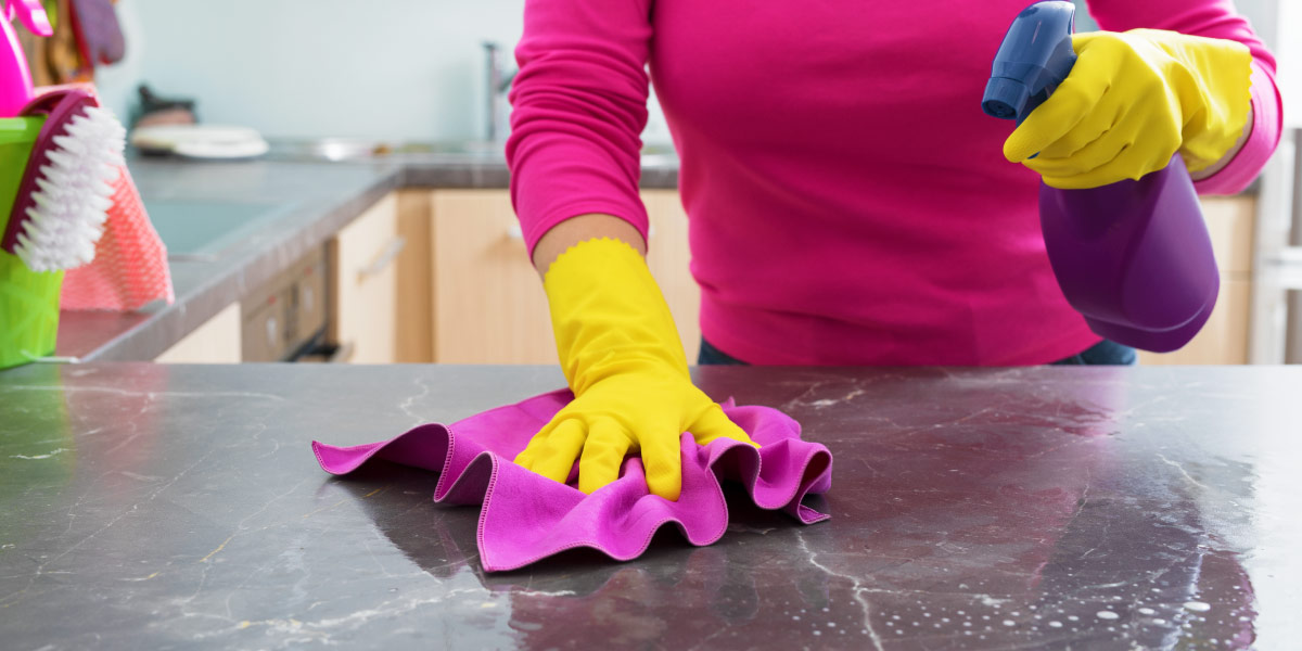 NaturalCleaner01 woman cleaning stone countertop