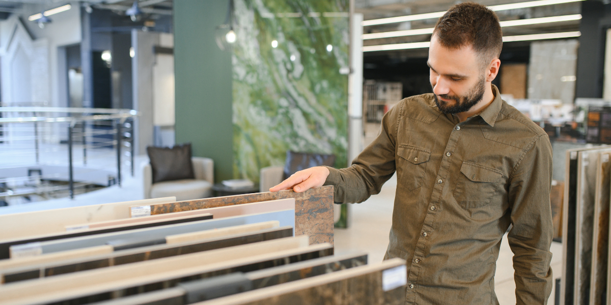 Man choosing from selection of natural stone samples