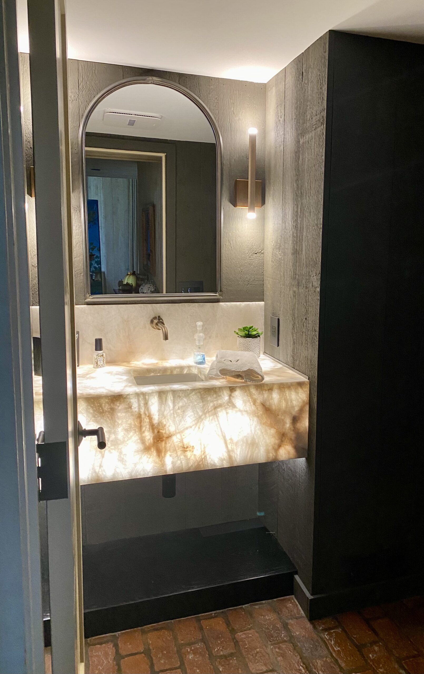 stone floating vanity with backlighting