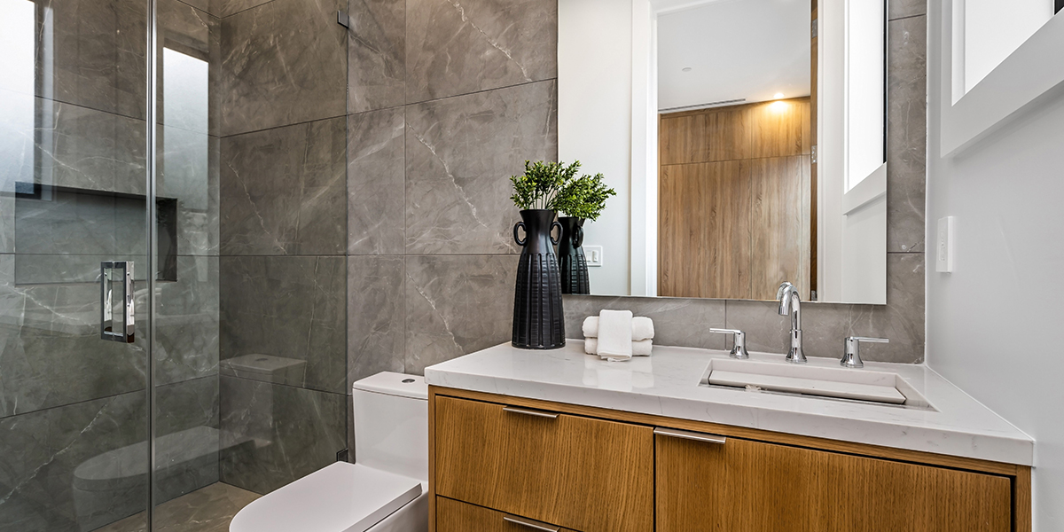 Modern bathroom with wooden vanity and glass shower