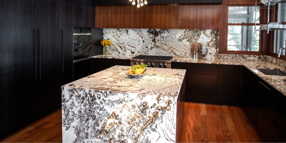 luxury stone countertop and kitchen island with wood cabinetry and and flooring