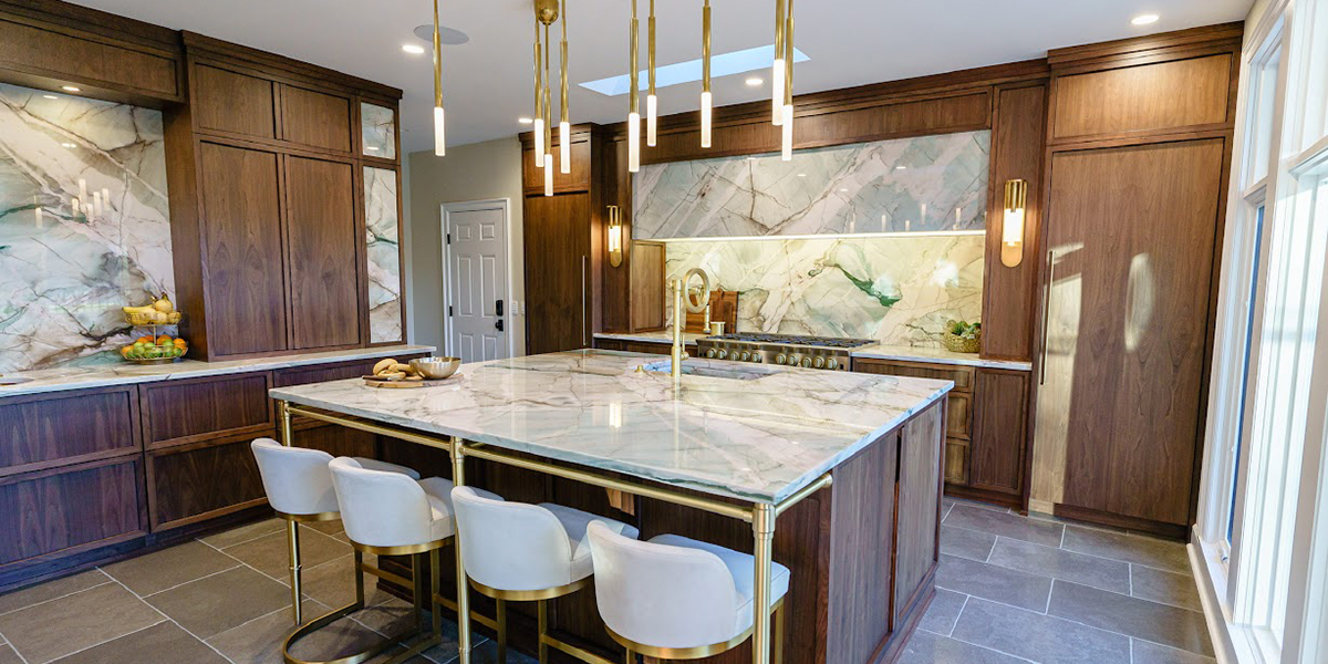 modern kitchen with dark wood cabinets and marble countertops